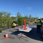 Community members picking up free trees at the Keep Nassau Beautiful tree giveaway event in Yulee